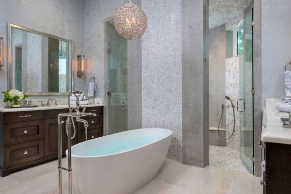 A bathroom with a large tub and shower