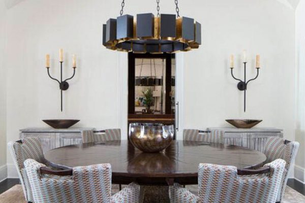 A dining room with round table and chairs
