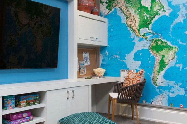 A room with a television and a map on the wall